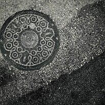 MANHOLE by John Bowman
